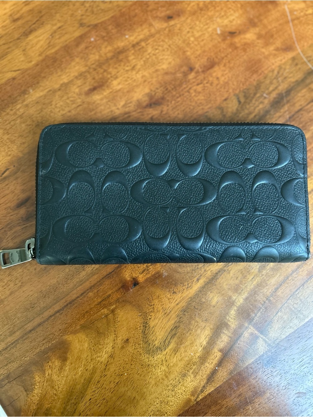 COACH Accordion Zip Black Wallet In Signature Embossed Leather.